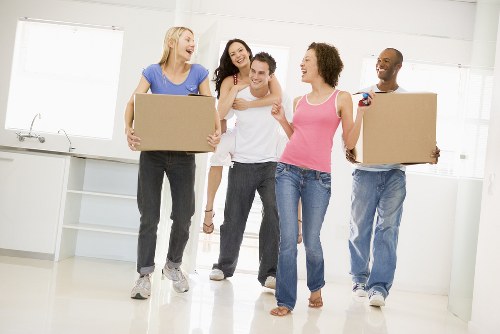 Students packing boxes for removals in Isleworth