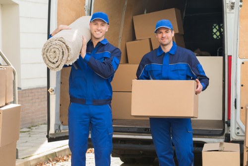 Local movers handling furniture during a house move in Isleworth