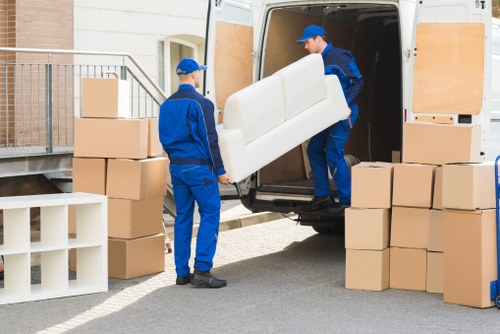 Man With A Van Isleworth team loading items safely with protective equipment