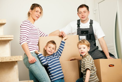Packed moving boxes and furniture ready for removals in Isleworth
