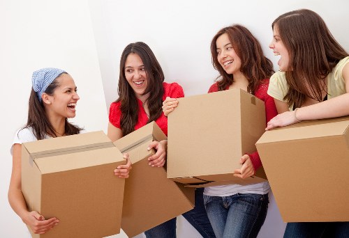 Office removal team moving desks and equipment