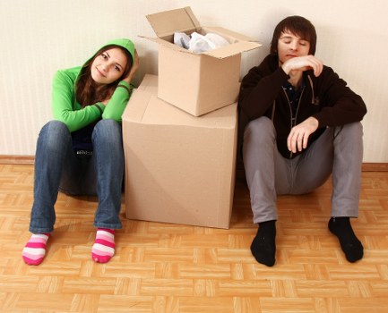 Professional movers transporting office furniture during an Isleworth relocation