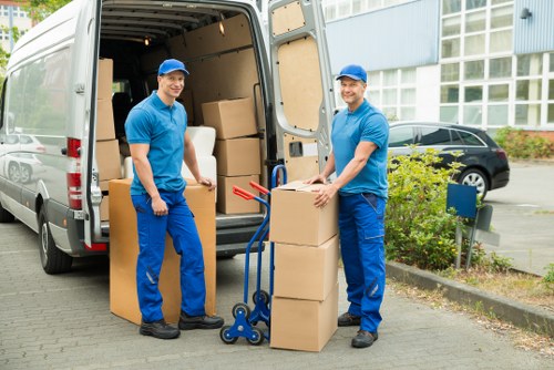 Organised flat relocation setup with boxes and furniture in Isleworth